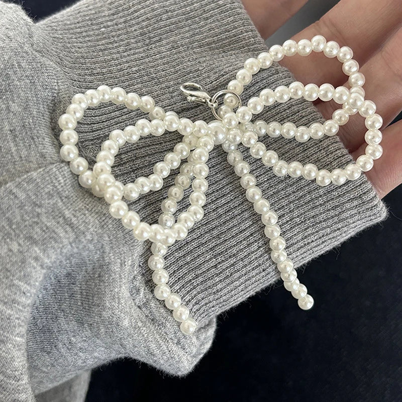 Double pearl bowknot charm