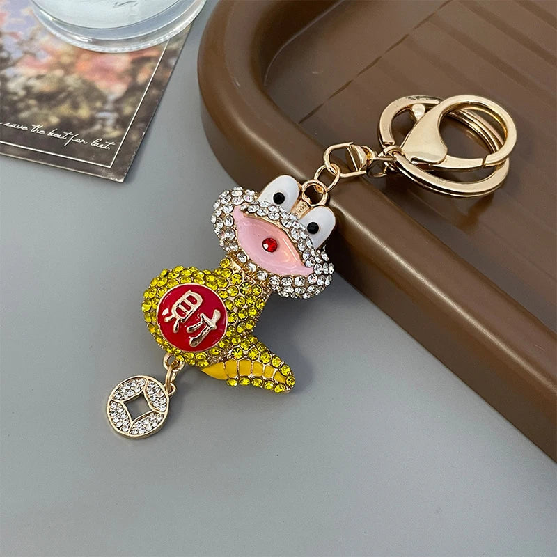 Rhinestoned cartoon snake charm