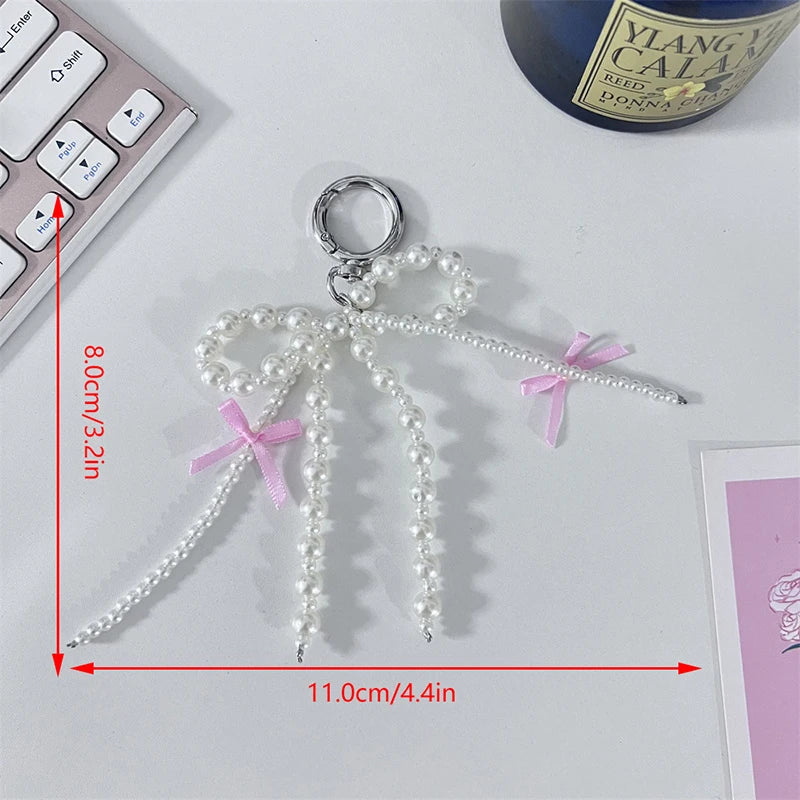 Pearl bow & heart charm